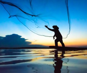 Cast net fishing Stock Photo
