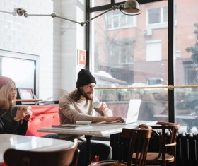 Couple drinking coffee browsing webpage Stock Photo 01