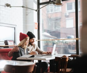 Couple drinking coffee browsing webpage Stock Photo 03