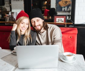 Couple drinking coffee browsing webpage Stock Photo 04