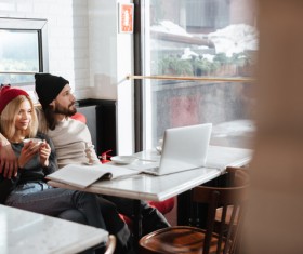 Couple drinking coffee browsing webpage Stock Photo 06