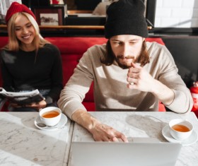 Couple drinking coffee browsing webpage Stock Photo 08
