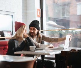 Couple drinking coffee browsing webpage Stock Photo 12