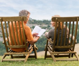 Couple relaxing reading book Stock Photo