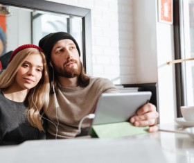 Couple using Tablet PC Listen to music Stock Photo 02