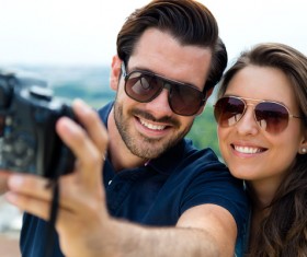 Couple using camera selfie Stock Photo