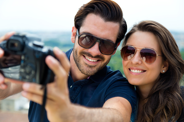 Couple using camera selfie Stock Photo