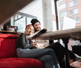 Couple using laptop video chat in cafe Stock Photo 02