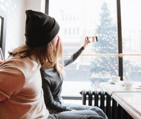 Couple using smartphone selfie in cafe Stock Photo 03
