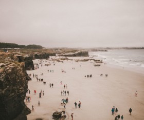 Crowded beach scenery in wintertime Stock Photo