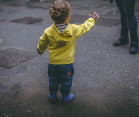 Cute little kid standing on road Stock Photo