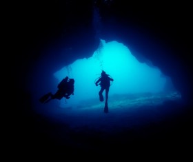 Diver inspect underwater cave Stock Photo 01