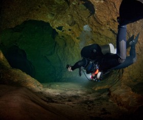 Diver inspect underwater cave Stock Photo 02
