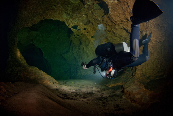Diver inspect underwater cave Stock Photo 02