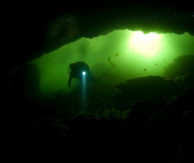 Diver inspect underwater cave Stock Photo 03