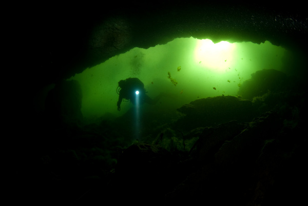 Diver inspect underwater cave Stock Photo 03