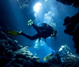 Diver inspect underwater cave Stock Photo 04