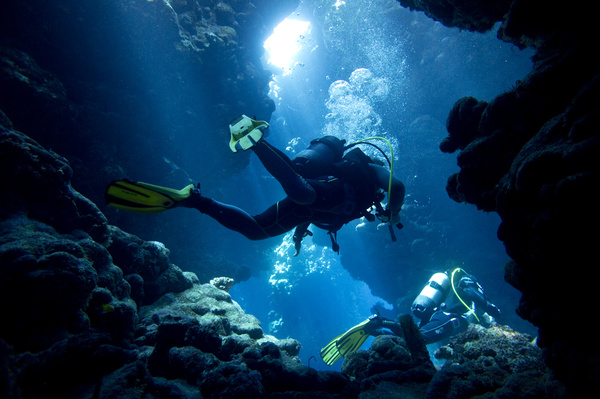 Diver inspect underwater cave Stock Photo 04