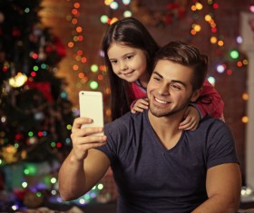 Father daughter using smartphone selfie Stock Photo