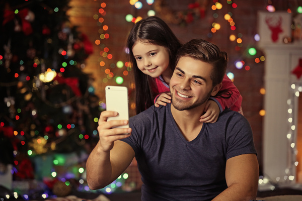 Father daughter using smartphone selfie Stock Photo