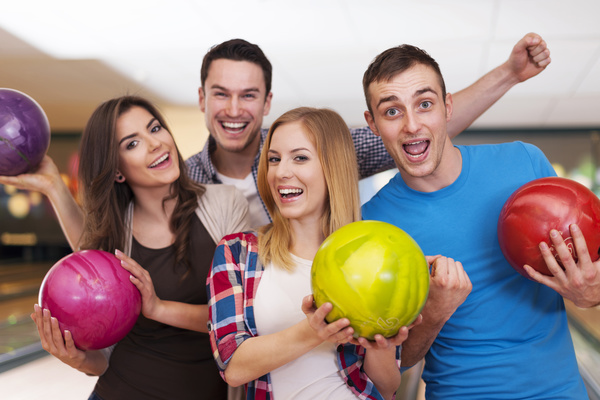 Friends bowling together Stock Photo 01