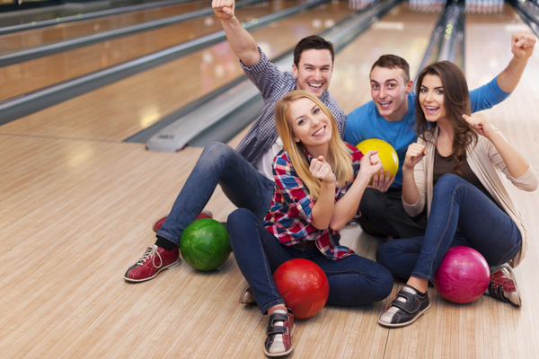 Friends bowling together Stock Photo 02
