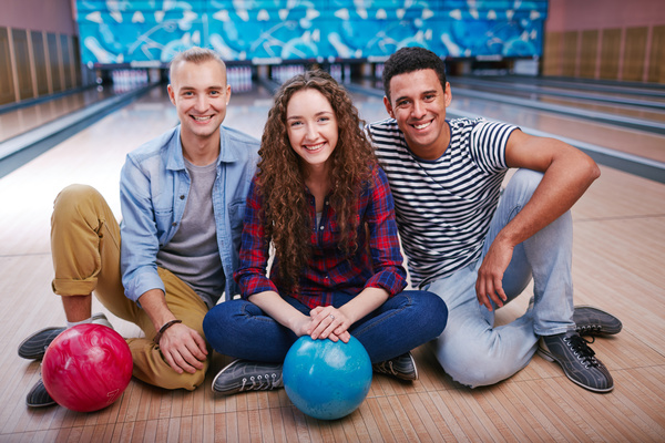 Friends bowling together Stock Photo 03