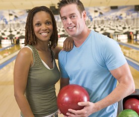 Friends playing bowling Stock Photo