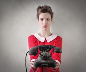 Girl holding old-fashioned phone Stock Photo