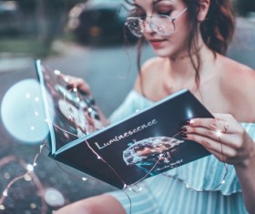 Girl reading magazine Stock Photo