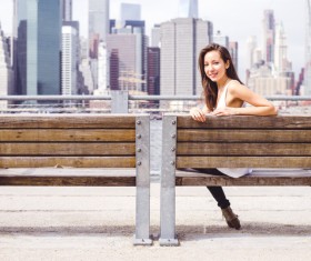 Girl sitting on the bench Stock Photo