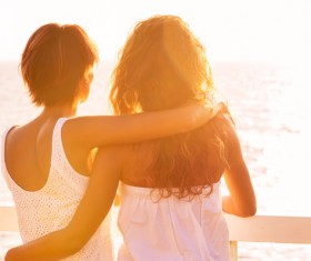 Girlfriend watching sunrise Stock Photo