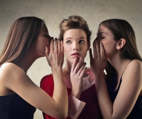Girls whispering Stock Photo