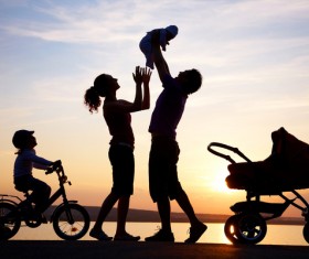 Happy family in the sunset Stock Photo