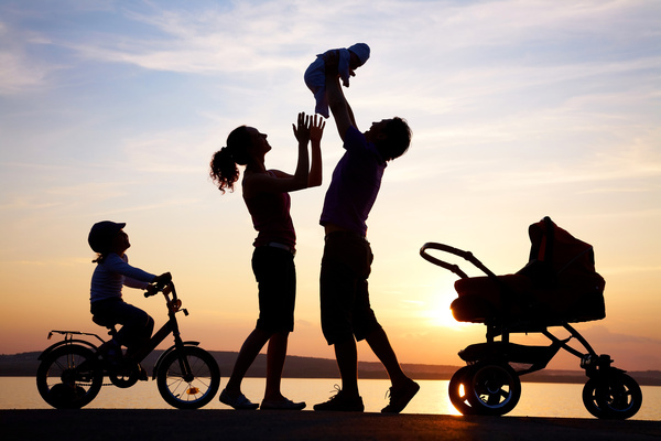 Happy family in the sunset Stock Photo