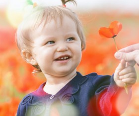 Holding red flowers cute little girl Stock Photo
