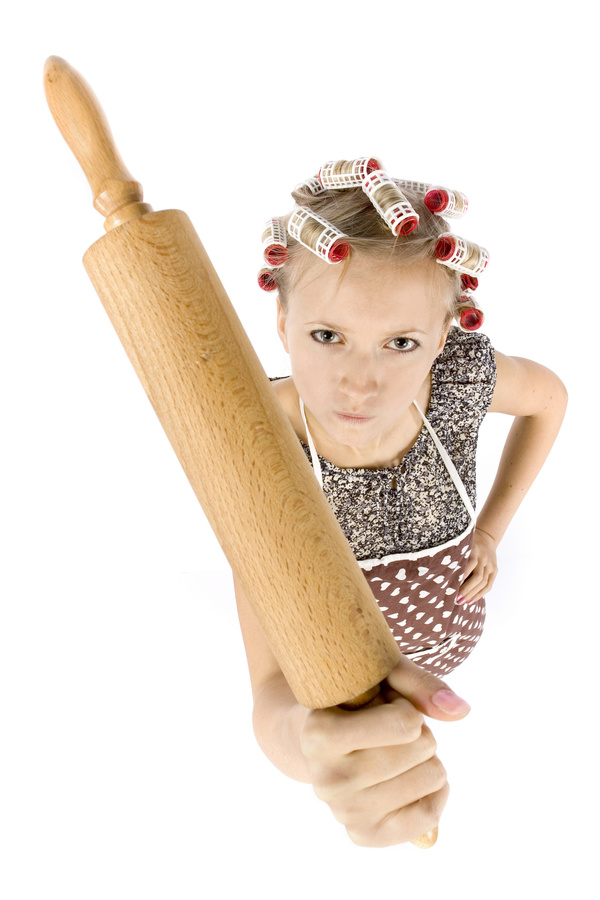 Housewife holding rolling pin Stock Photo