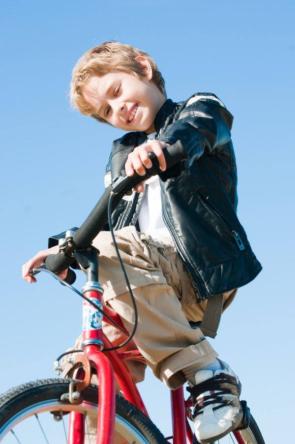 little boy riding bicycle