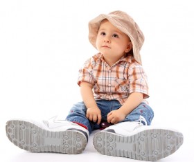Little boy wearing fathers shoes Stock Photo