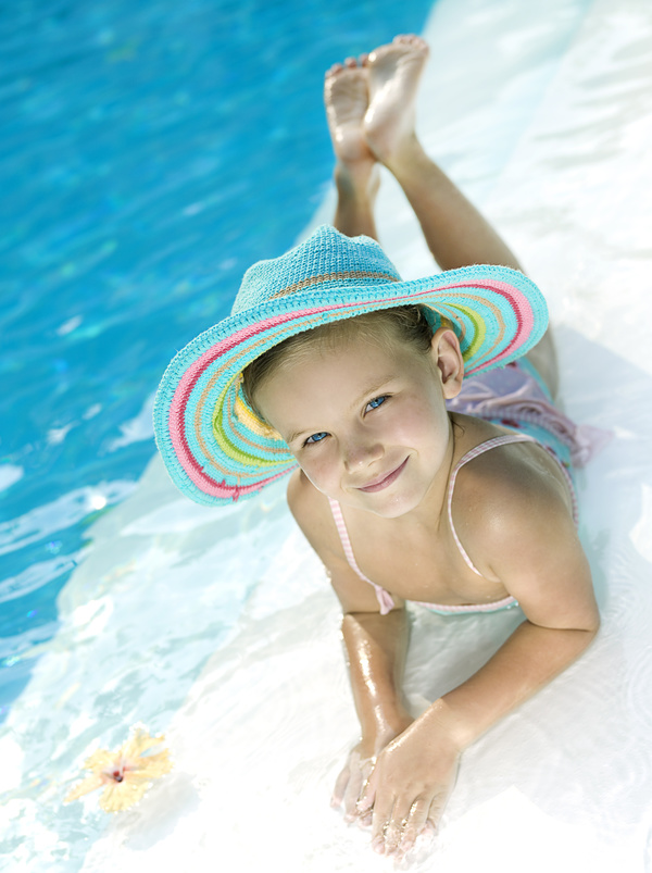 Little girl by the pool Stock Photo