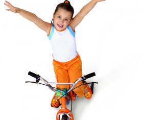 Little girl rides bicycle Stock Photo