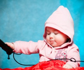 Little kid playing with microphone Stock Photo