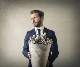 Man holding a trash can Stock Photo