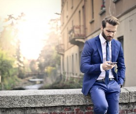 Man looking at cell phone Stock Photo