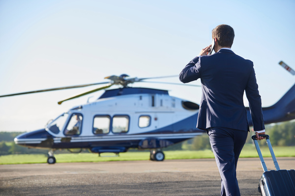 Man preparing to ride helicopter Stock Photo