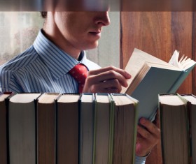 Man reading in a library Stock Photo