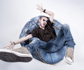 Man sitting on inflatable chair Stock Photo