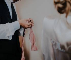 Man tying a bow tie Stock Photo