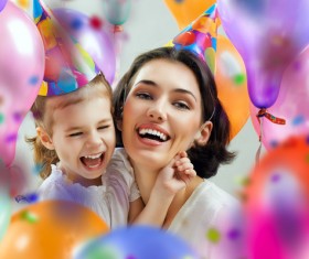 Mom celebrates her daughters birthday Stock Photo 01