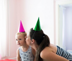 Mom celebrates her daughters birthday Stock Photo 02